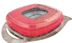 Czerwony, futurystyczny stadion Allianz Arena, często uznawany za najładniejszy stadion na świecie, z widokiem na trybuny.